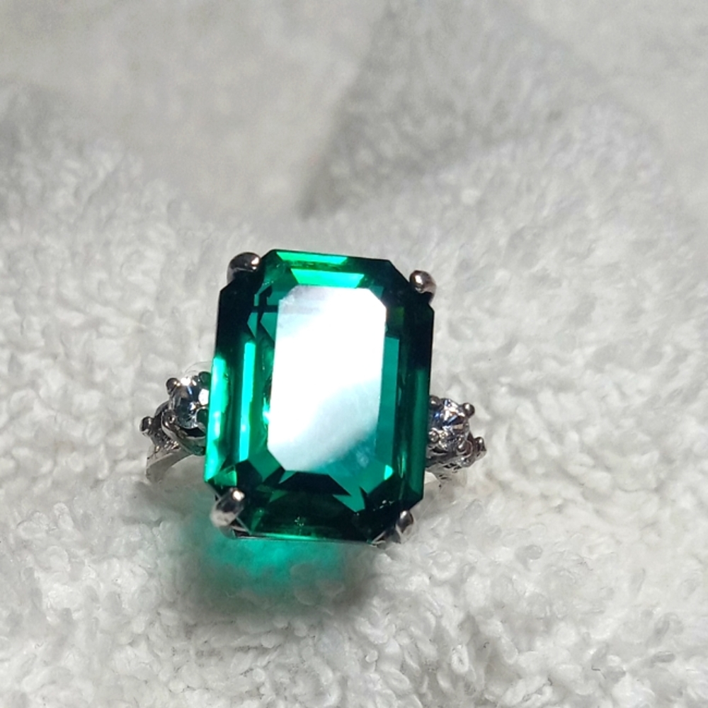 Antique emerald octagon cut engagement ring